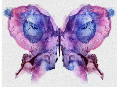 Watercolor butterfly painted in blue, purple, and pink tones.